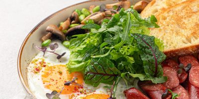 Classic english breakfast with fried eggs and sausages